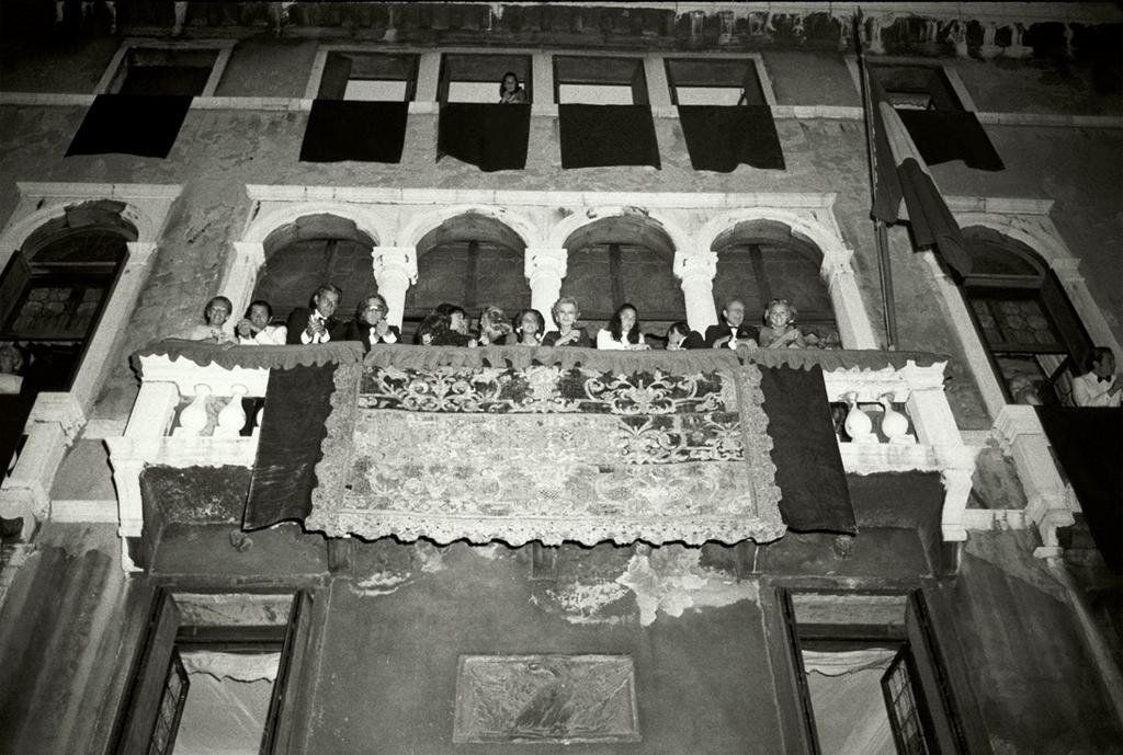 Jack Nisberg for Vogue, ca. 1973. Guests on the tapestry-hung balcony of the Palazzo Volpi, during a ball given by Conte Giovanni Volpi di Misurata for the 18th birthday of his niece, Donna Olimpia Aldobrandini